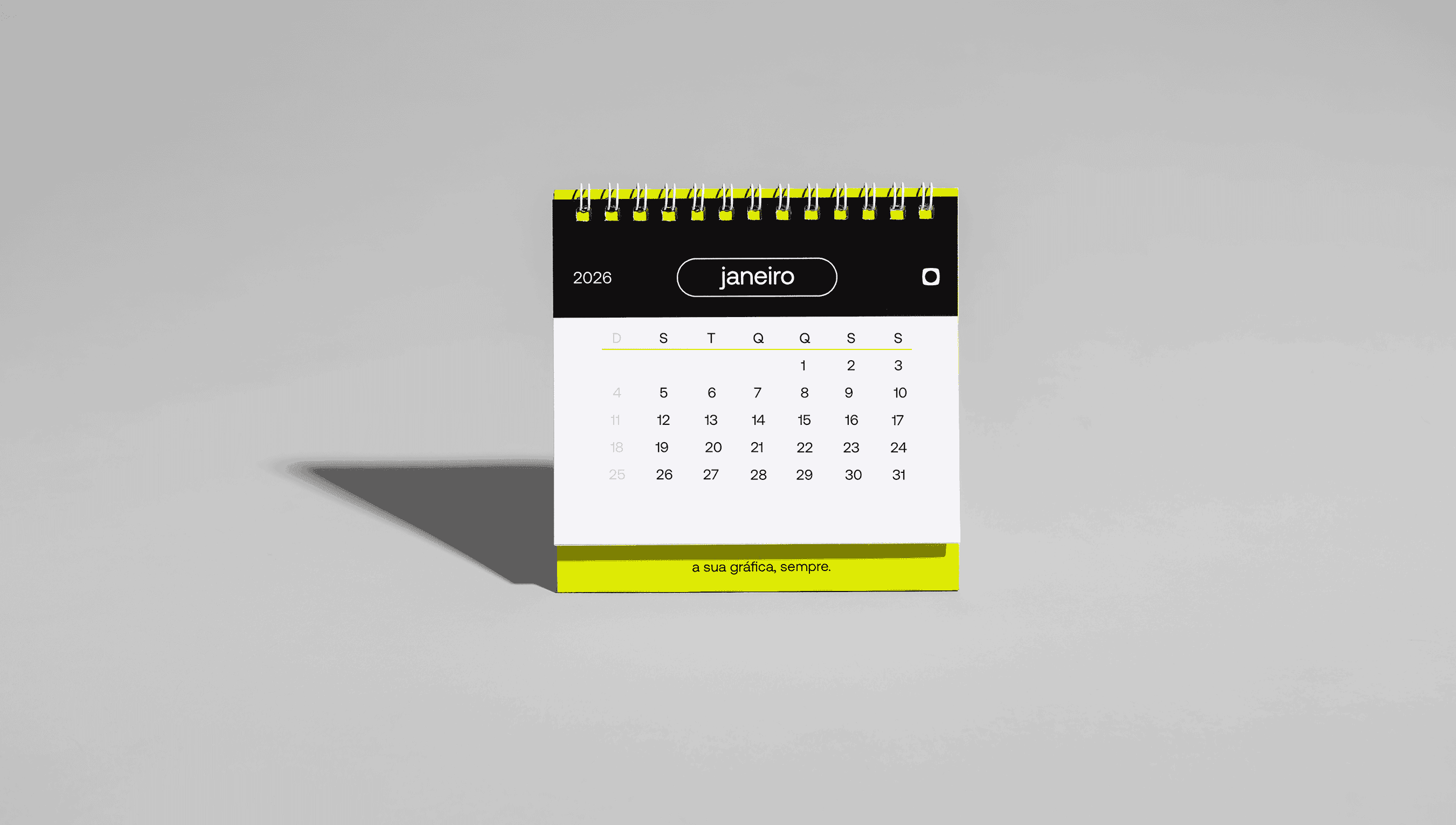 Calendário de mesa personalizado com espiral amarelo mostrando o mês de janeiro de 2026